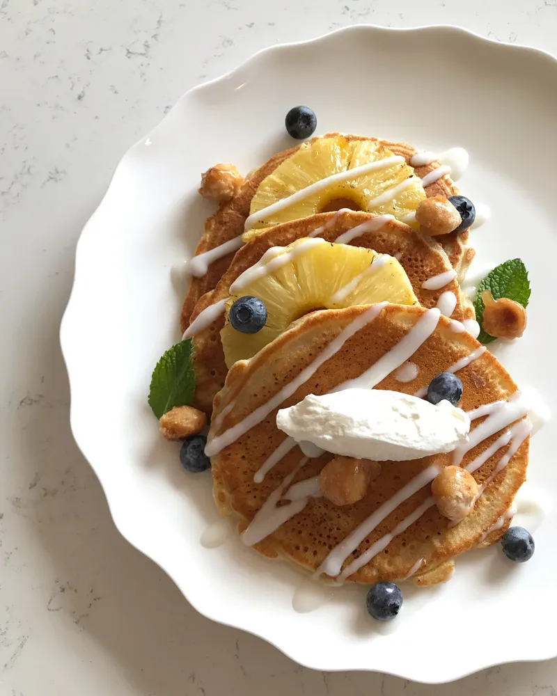 Coconut pancakes with grilled pineapple and blueberries