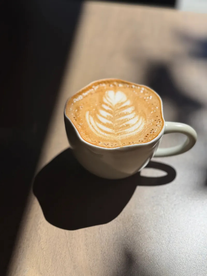 Latte with leaf art at Liv Café & Bistro